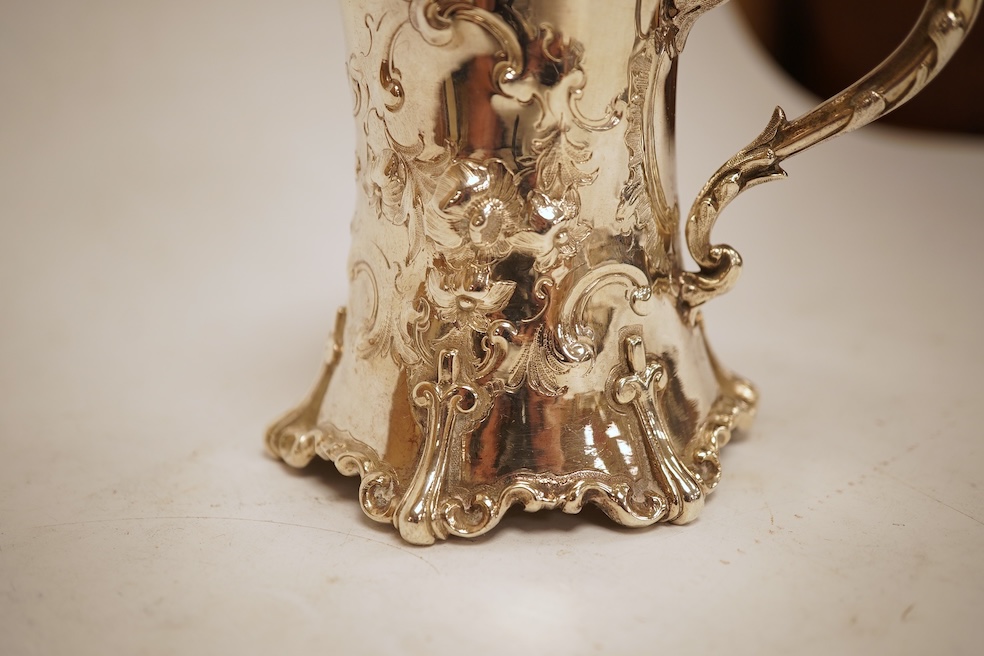 A Victorian embossed silver christening mug, of waisted form, by John Keith, London, 1851, height 10.2cm, 5.8oz.